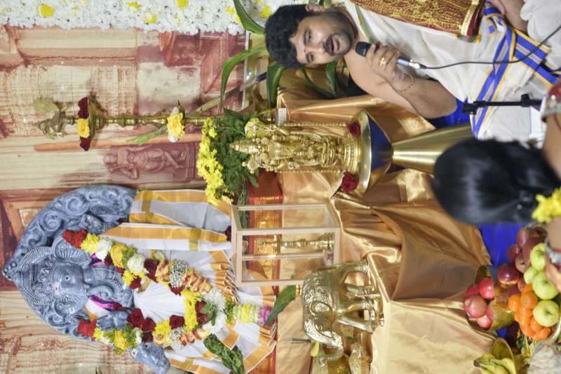 Priest with Ganesha idol and decorations