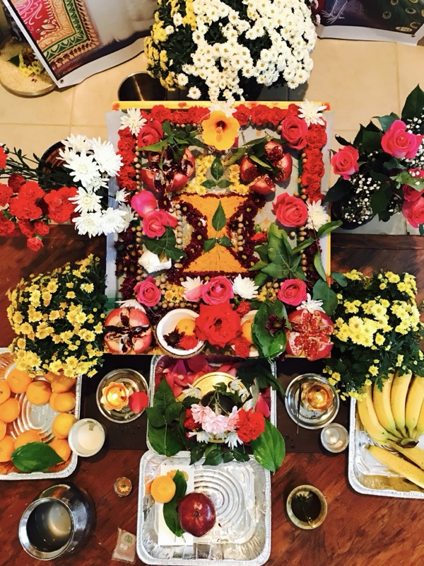 Beautiful flower rangoli pooja setup