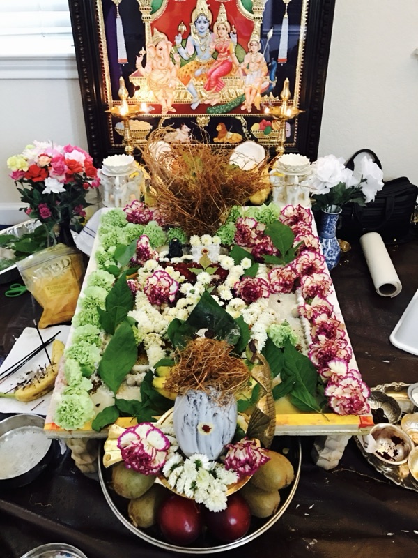 Shiva Parvati deity with floral offerings